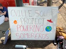 sign that reads cville solar project powering Sombrero's 