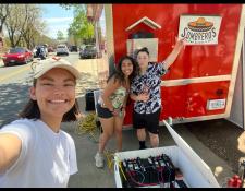 students in front of the food truck