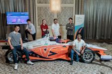 A group of six UVA Engineering students, who went to Kennedy Space Center to perform the demo, pose with CAVCAR.