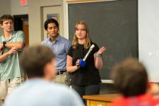 A student speaks during a capstone presentation