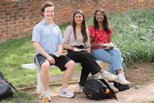 Students seated on a bench