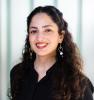 Yasmina smiling in professional headshot