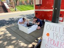 students setting up the solar for the food truck