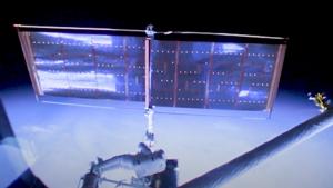 Thornton floats near a Hubble solar panel.